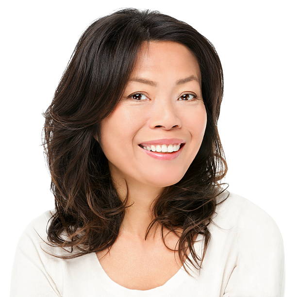 Asian woman smiling happy Asian woman smiling happy portrait. Beautiful mature middle aged Chinese Asian woman closeup beauty portrait isolated on white background. black hair stock pictures, royalty-free photos & images