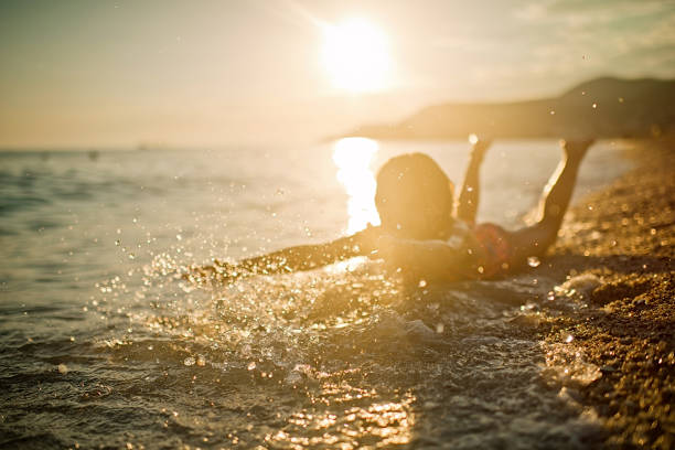 Child having fun in the sea