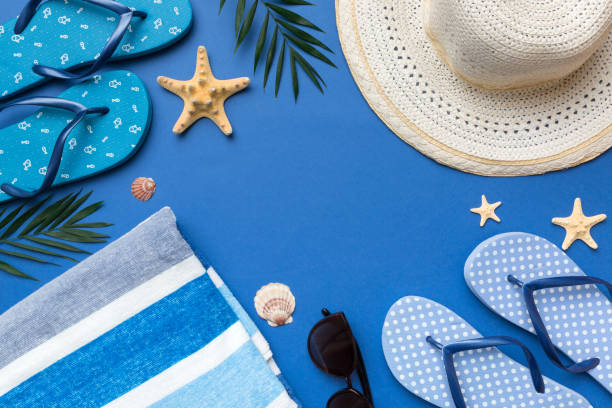 istock Summer vacation concept flat lay. straw hat beach accessories and towel top view. Space for text. travel concept 1412439710