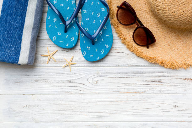 istock Summer vacation concept flat lay. straw hat beach accessories and towel top view. Space for text. travel concept 1412439720