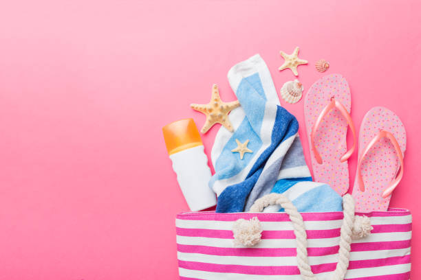 istock beach accessories flat lay top view on colored background Summer travel concept. Bag with starfish and sea shell. Top view 1412439736