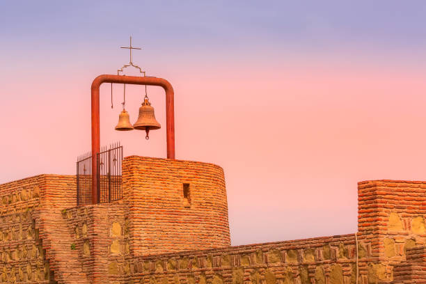 istock Bell tower in Tbilisi, Georgia, pink sunset 1412442628