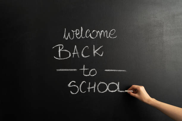 istock Back to school sign on chalk board background. 1412444671