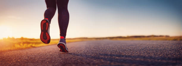istock Woman running outdoors on the evening sunset. 1412445067
