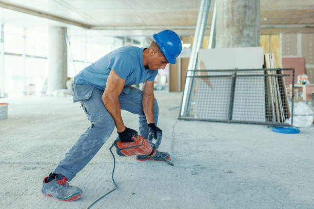 istock Using a hammer drill takes a lot of effort 1412445258