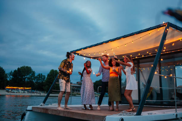 istock Birthday party with sparklers on river 1412445323