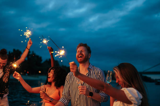 istock Multiracial smiling friends enjoying on the boat 1412445449