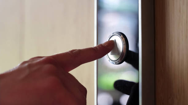 Close-up view on female hand pushing elevator lift button in business center. Close-up view on female hand pushing elevator lift button in business office center. Young businesswoman, intern, worker, student, employee pressing button up as sign of successful growth. Slowmotion. hand elevator stock pictures, royalty-free photos & images
