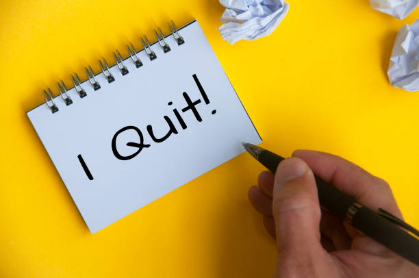 istock I quit text on white notepad on yellow cover background. Resignation 1412449985