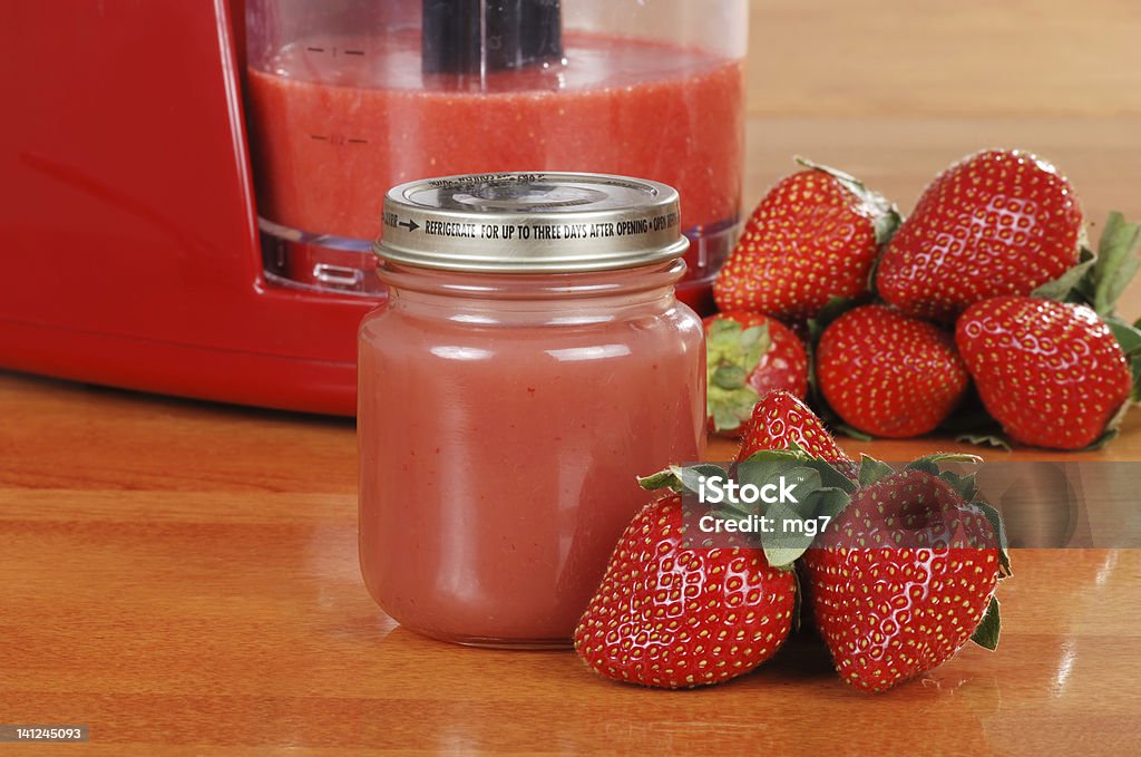 Homemade strawberry baby food closeup of Homemade strawberry baby food with jar Appliance Stock Photo