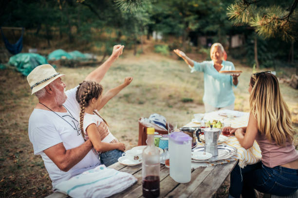 istock multigenerational  family having breakfast in nature 1412453175