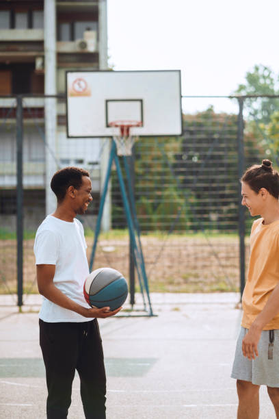 istock Friends playing basketball 1412456012