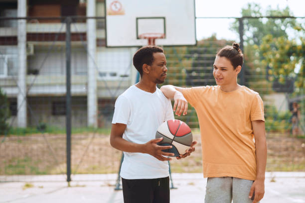 istock Friends playing basketball 1412456050