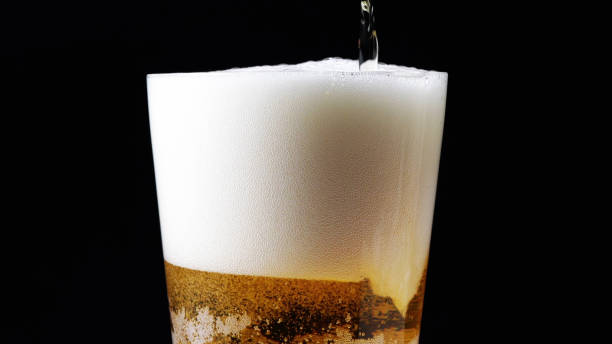 istock Glass Of Beer Being Poured 1412458536