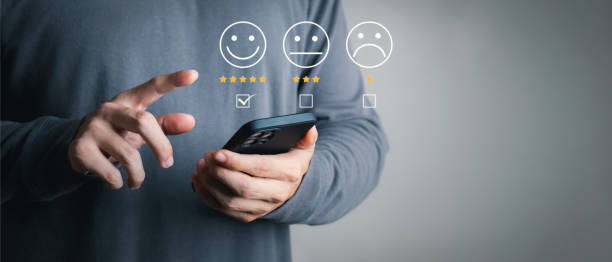 istock User give rating to service experience on online application, Customer review satisfaction feedback survey concept, Customer can evaluate quality of service leading to reputation ranking of business. 1412459584
