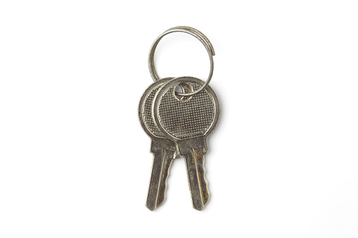 Gray metal key isolated on white