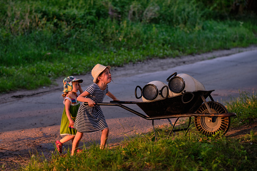 Mother and son on the tractor trailer during harvesting