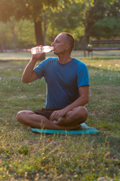 istock Photo of a middle aged man drinking water 1412474228