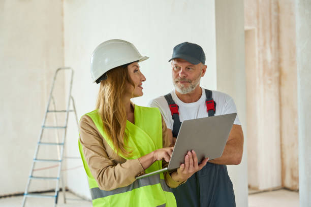 istock Agent communicates with adult worker hold open laptop in hands 1412474475