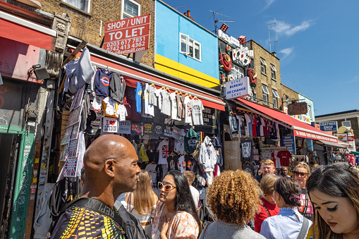 People shopping on Camden High Street in Camden Town at Borough of Camden, London