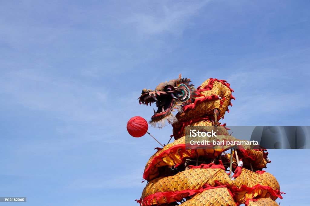 Dragon doll figure in Chinese tradition Dragon doll figure often presented in the cultural celebrations of the Chinese community. Acrobat Stock Photo