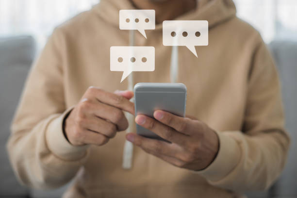 istock Young man hand holding and typing on smartphone chatting with friend on application. Communication digital website and social network concept. 1412482348