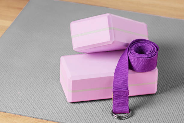 istock Yoga blocks, exercise mat and yoga belt for training. 1412482494