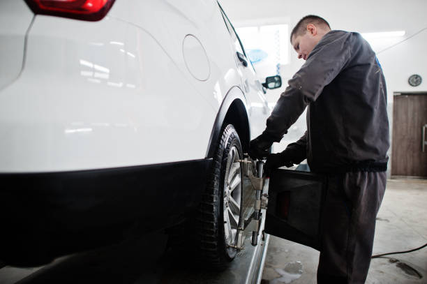 istock Mechanic Working on Car in Garage 1412483414