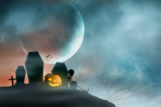 istock Jack O'Lantern Sits In Small Cemetery In Front Of Rising Moon 1412484538