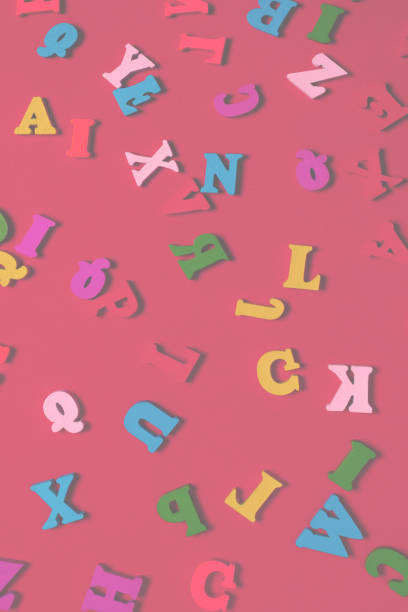 istock Random colorful alphabet on a red background, colorful letters. 1412487315