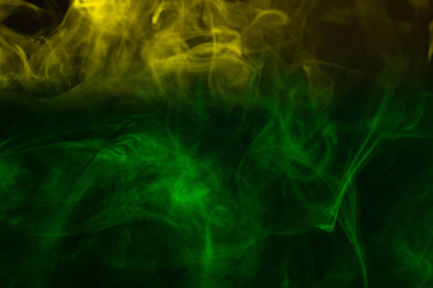 istock Yellow steam on a black background. 1412487350