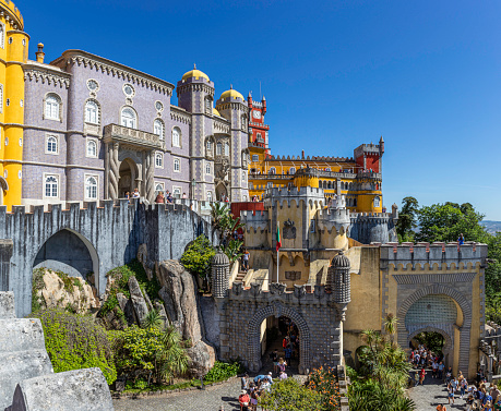 Pena Palace stands on the top of a hill in the Sintra Mountains above the town of Sintra. On a clear day it can be easily seen from Lisbon. The palace is a UNESCO World Heritage Site and one of the Seven Wonders of Portugal.
