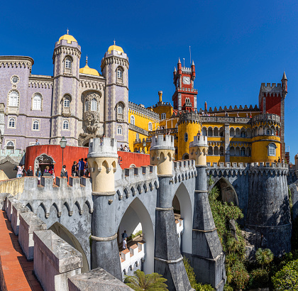 Pena Palace stands on the top of a hill in the Sintra Mountains above the town of Sintra. On a clear day it can be easily seen from Lisbon.  The palace is a UNESCO World Heritage Site and one of the Seven Wonders of Portugal.