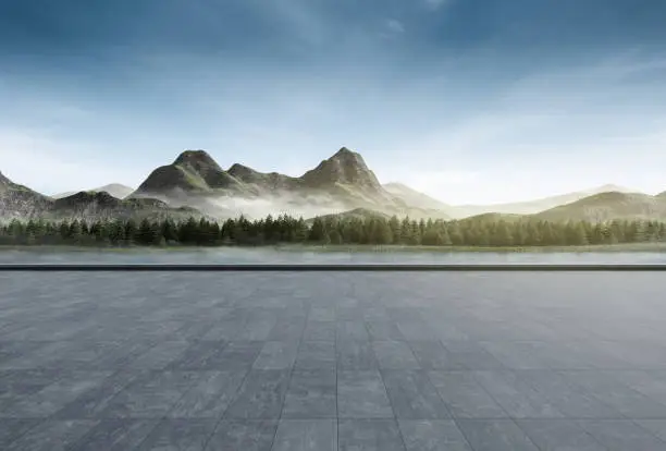 Photo of Empty concrete floor with mountain and blue sky lake view.