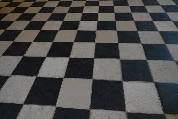 istock Top view on a black and white checkerboard floor 1412493410