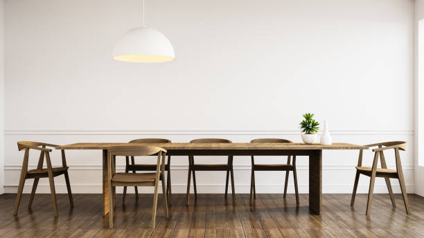 istock White wall and Wood modern chairs in dining room interior - 3D rendering 1412495446