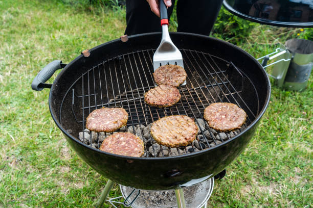 istock Selective focus of fresh delicious burger cutlets grilling on bbq grill 1412497731