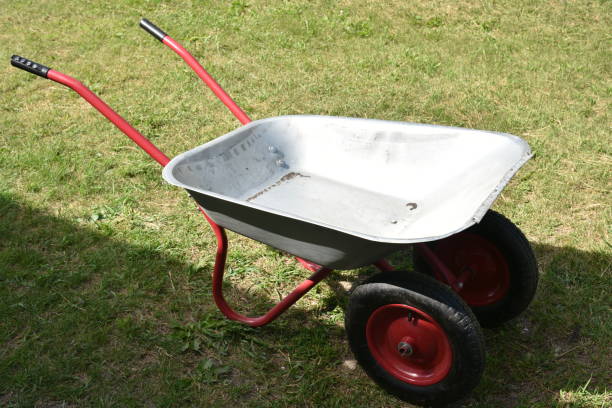 istock An empty garden iron cart in a summer park 1412501889