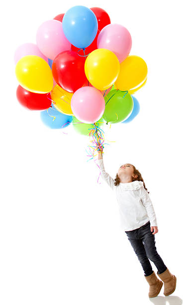 istock Girl with helium balloons 141250259