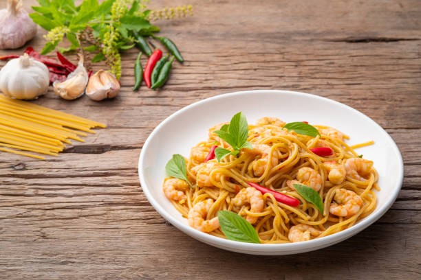 istock stir fried spicy spaghetti with shrimp and basil 1412502793