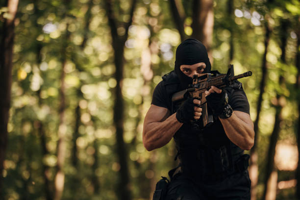 istock SWAT team soldier in action 1412504466