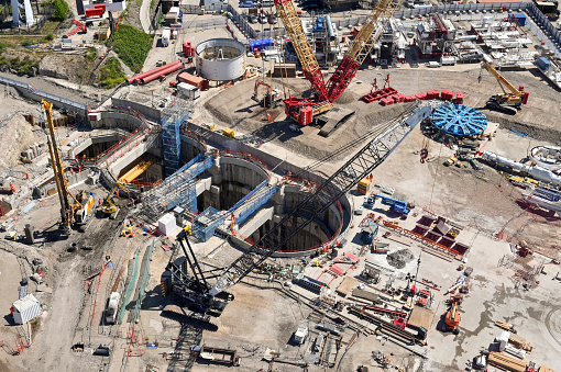 London, England - June 2022: Aerial view of a large construction site with tunnellling machinery near the Royal Docks in East London