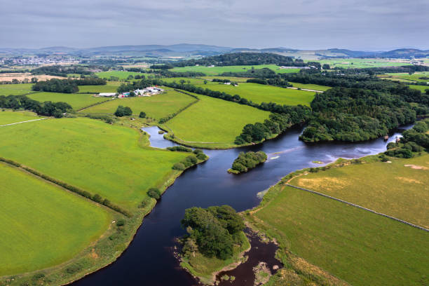 istock Drone view of a river flowing in a rural location 1412505236