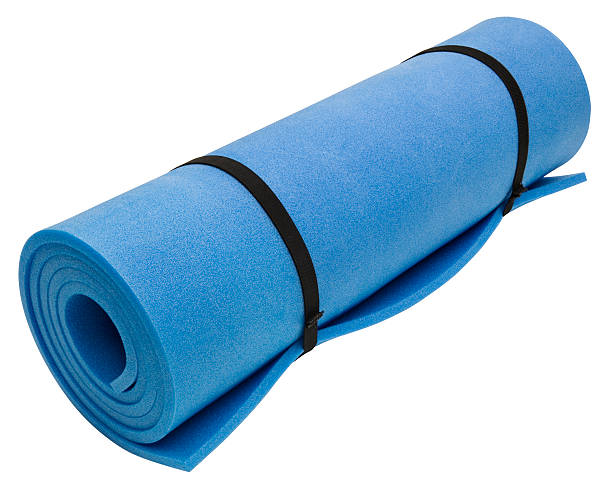 istock Blue rolled up exercise yoga mat on white 141250575