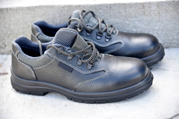 istock Black new work boots on the street during the day. 1412506525