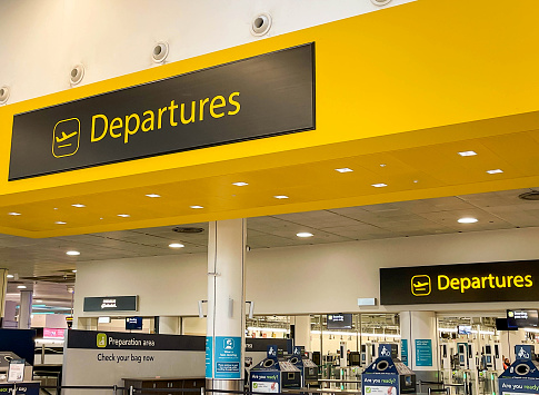 London, United Kingdom - May 2022: Sign above the entrance to the departures hall at the North Terminal at  London Gatwick airport.