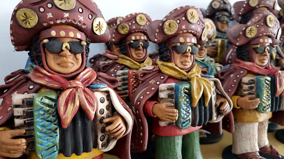 Caruaru, in the state of Pernambuco, Brazil, has many famous clay craftsman. The art  can show scenes or tells stories about the local people, or from a special event. These dolls were made to honor one of the greatest artists, Luis Gonzaga.