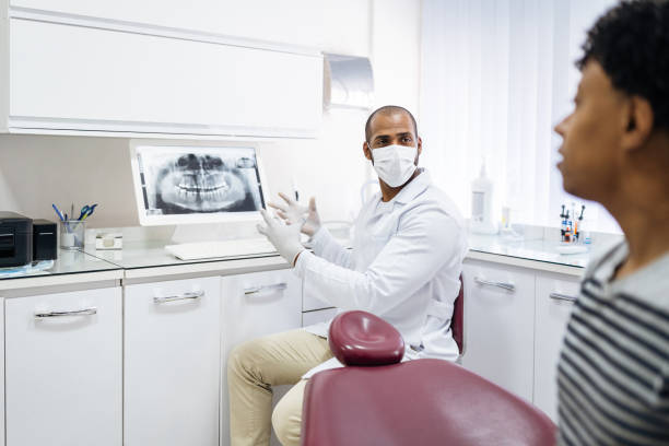Dentist showing an x-ray on the computer