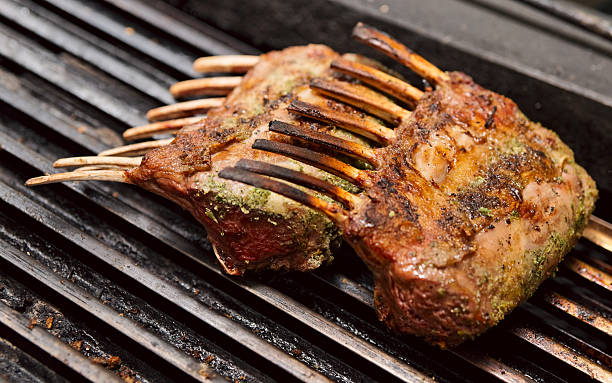 Rack of lamb on grill Marinated rack of lamb frying on grill rack of lamb stock pictures, royalty-free photos & images