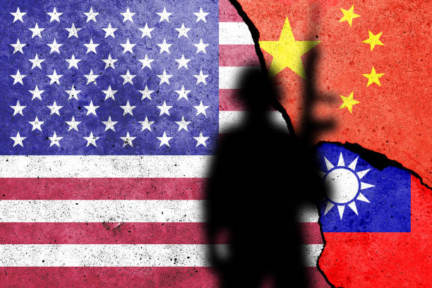 United States of America, China and Taiwan  flags painted on the concrete wall with soldier shadow. USA and China war concept stock photo